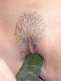 Amateur inserts cucumber in her asian pussy