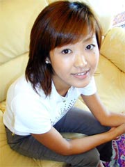 Asian amateur teen strips on sofa and poses