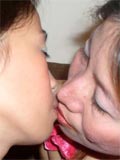 Two shaved asian lesbians kissing and fingering each others